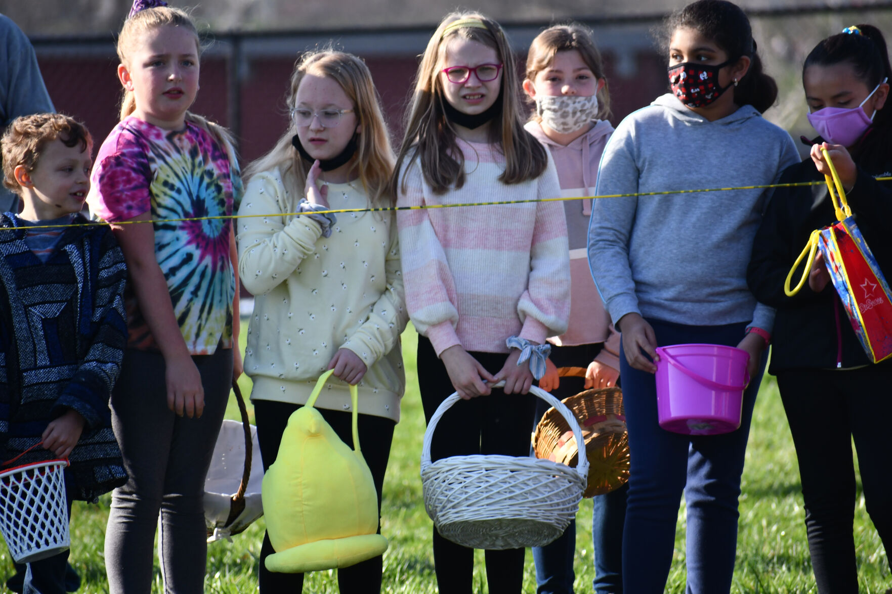Children wait to collect eggs